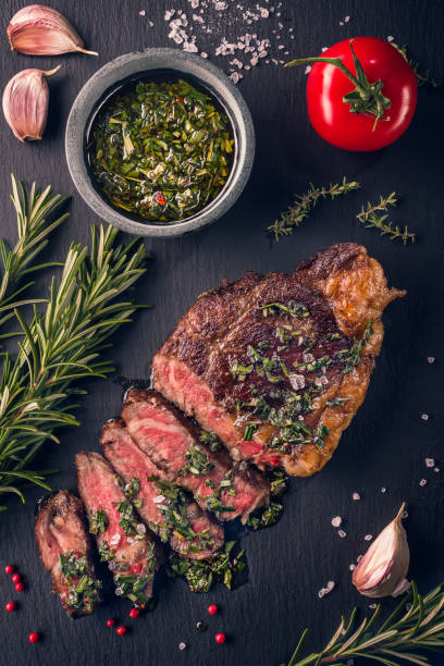 Juicy tender sous-vide grilled irish beef rump steak with fresh herbs stock photo