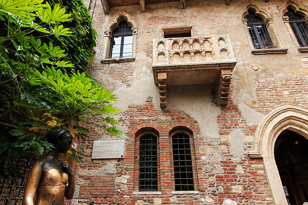 Juliet's balcony and Juliet statue - Verona - Italy stock photo