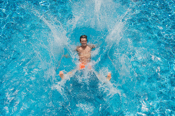 Jumping Into A Swimming Pool stock photo
