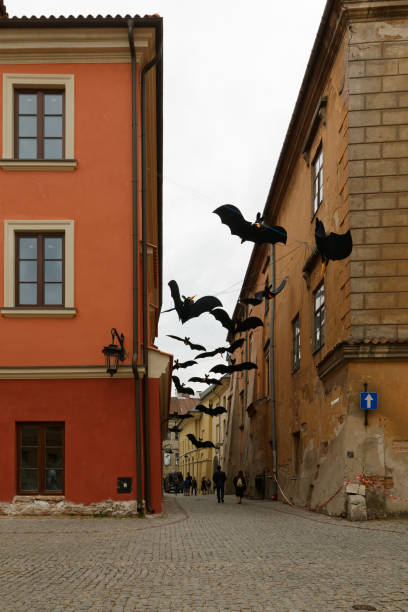 LUBLIN, LUBELSKIE POLAND - 26 June 2021: Hanging bats at old town Lublin street stock photo