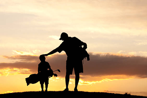 Junior Golfer With Father stock photo
