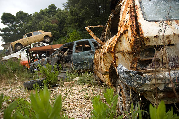 junkyard full of rusty wrecks stock photo