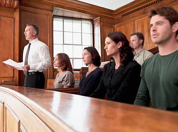 Jury sitting in courtroom  courtroom stock pictures, royalty-free photos & images