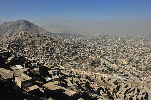 Kabul city view "Kabul, an outgrown city in the smog, new houses on every inch of the surrounding hills" afghanistan stock pictures, royalty-free photos & images