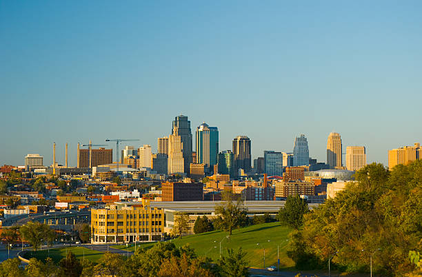 Kansas City at late afternoon View of the Kansas City skyline at late afternoon with a park area in the foreground. kansas city kansas stock pictures, royalty-free photos & images