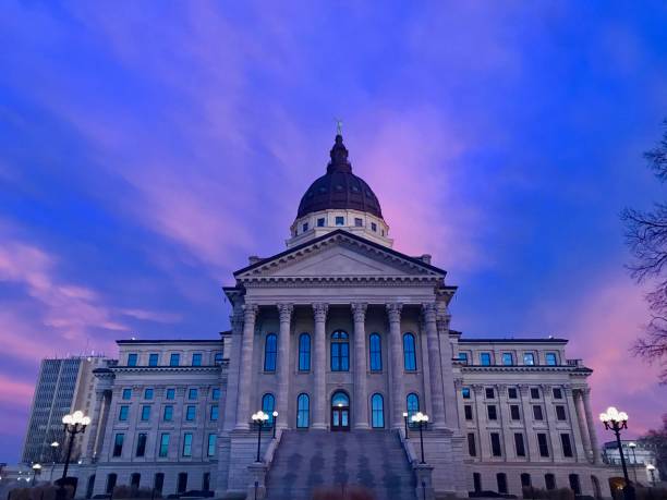 Kansas State Capitol at Sunset, Topeka, Kansas image shows the Kansas State Capitol building during a colorful sunset topeka stock pictures, royalty-free photos & images