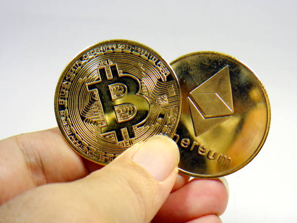 Kaohsiung, Taiwan, July 11, 2022.Hand holding bitcoin and Ethereum on white background Hand holding bitcoin and Ethereum on white background  With Ethereum  stock pictures, royalty-free photos & images