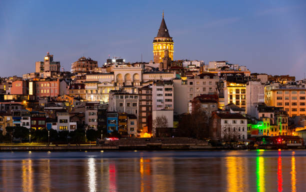 karakoy and galata tower from golden horn bay in twilight, istanbul, turkey - karaköy istanbul stockfoto's en -beelden