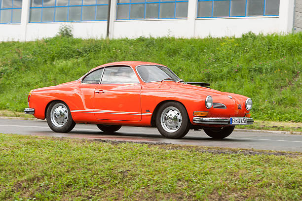 Karmann Ghia Coupé 1964 Heiligenstadt, Bavaria, Germany-July 19, 2009: German classic car Karmann Ghia Coupé 1964 on the way to a classic car show. 1964 stock pictures, royalty-free photos & images