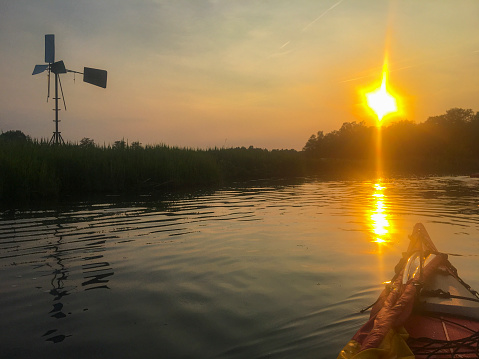 Kayaking in a nature reserve at the end of a beautiful summer day