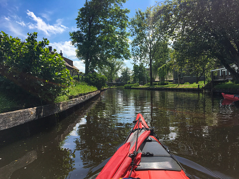 Kayaking in the Weerribben-Wieden nature reserve during a beautiful summer day