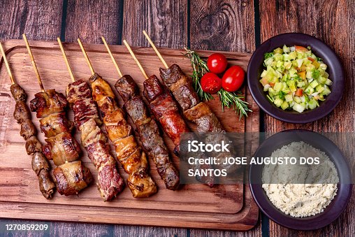 istock Kebab - Grilled meat on a cutting board, with flour and vinaigrette salad 1270859209