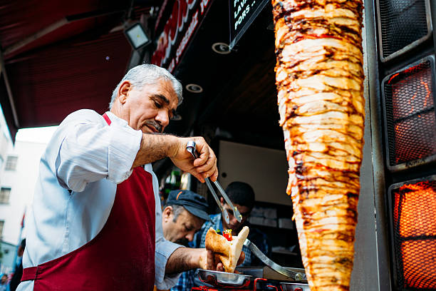 kebab seller in istanbul - döner stockfoto's en -beelden