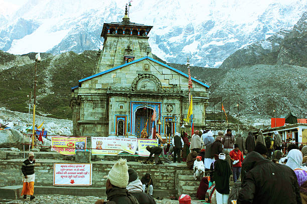Kedarnath temple Kedarnath, India - May 31, 2015: Hindu pilgrims waiting in queue to enter Kedarnath temple in Uttarakhand, India. This is one of the 12 Jyotirlinga temples dedicated to Hindu god Shiva at an altitue of 11500 feet. kedarnath temple stock pictures, royalty-free photos & images