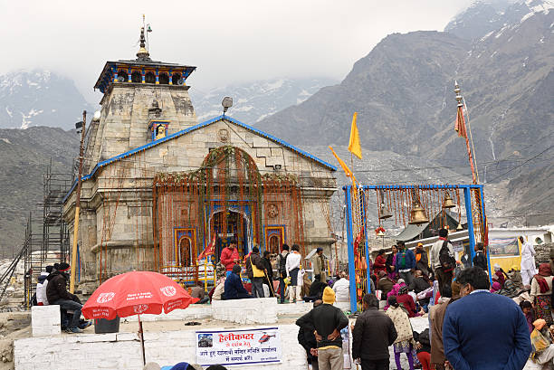 Kedarnath Temple  Kedarnath,  Uttarakhand, India - May 18, 2016:   Kedarnath Temple is one of the holiest Hindu temples dedicated to the god Shiva ,and is located on the Garhwal Himalayan range ,pilgrims in front of the temple kedarnath temple stock pictures, royalty-free photos & images