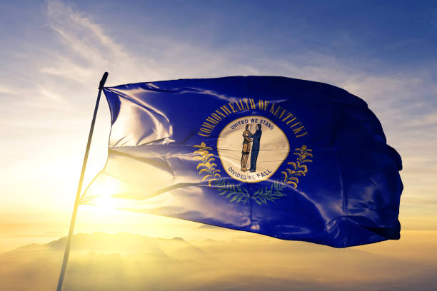 Kentucky state of United States flag textile cloth fabric waving on the top sunrise mist fog Kentucky state of United States flag on flagpole textile cloth fabric waving on the top sunrise mist fog kentucky stock pictures, royalty-free photos & images