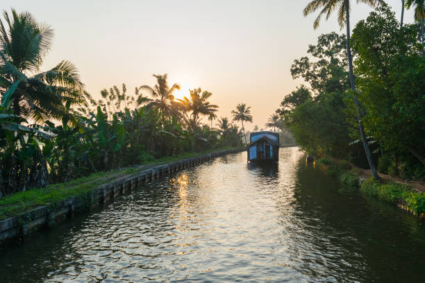 Kerala backwater boat cruise with sunset stock photo