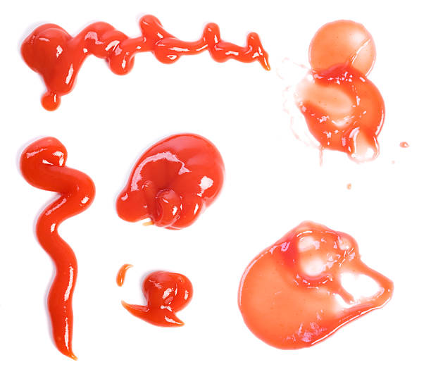 Ketchup ketchup splashes and squirts on white ketchup smear stock pictures, royalty-free photos & images
