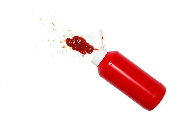 ketchup spill stain mucky white background stock photo