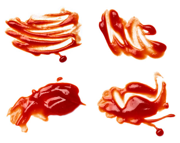 ketchup stain fleck  food drop tomato sauce accident liquid splash dirty fleck red close up of  a ketchup stain on white background ketchup smear stock pictures, royalty-free photos & images
