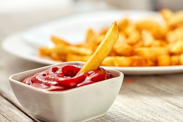 Ketchup with french fries stock photo