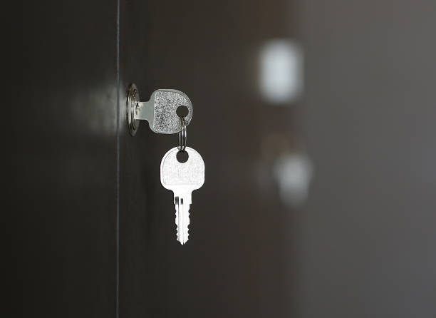 Key In Keyhole On Wooden Cabinet Key In Lock Stock Photo