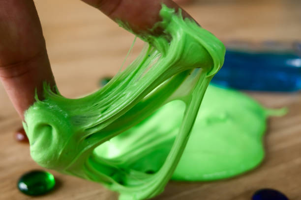 Kid Playing Hand Made Toy Called Slime, Experiment Scientific Method stock photo
