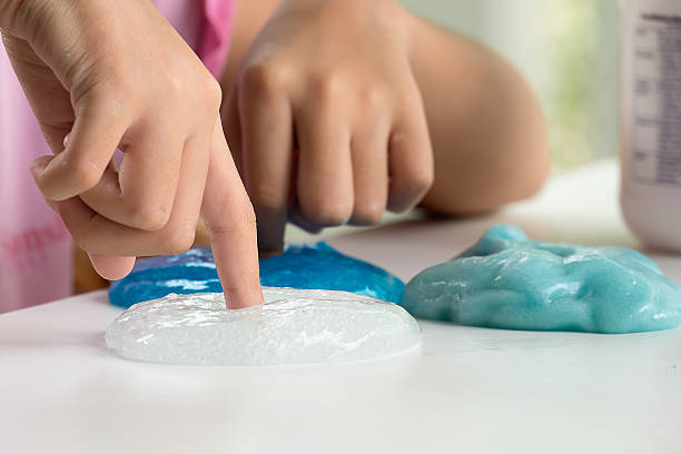Kid Playing Hand Made Toy Called Slime stock photo