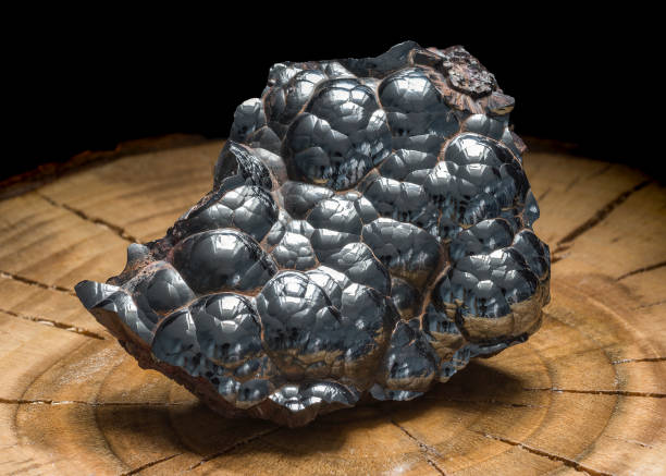 Kidney resembling hematite rock with its undulated metallic surface. Botryoidal iron oxide crystal mineral. A solid mass of lustrous kidney ore hematite stock photo