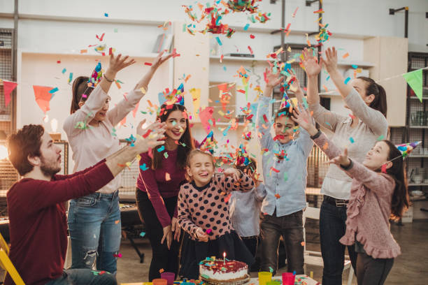 Kids birthday party Group of people, teachers and children in music school, having a children birthday party together. classroom party stock pictures, royalty-free photos & images