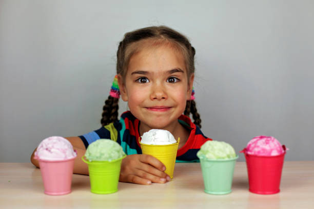 Kids eating an ice cream stock photo