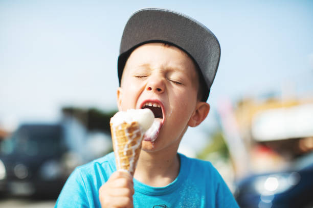 Kids eating ice-cream Kids eating ice-cream cream dairy product photos stock pictures, royalty-free photos & images