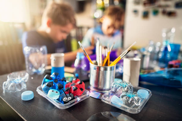 Kids upcycling - creating new fun stuff from used stuff Two boys making fun making fun stuff from garbage at home. They are using plastic bottles, cans to create toys and useful stuff.
Nikon D850 upcycling stock pictures, royalty-free photos & images
