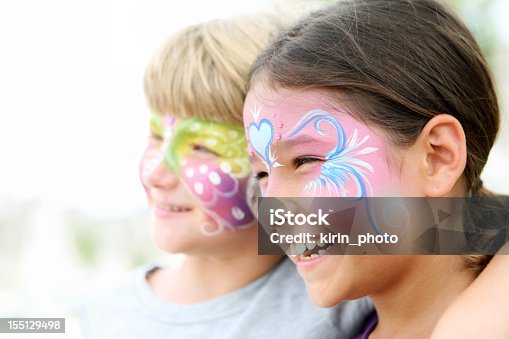 istock Kids with painted faces smiling 155129498