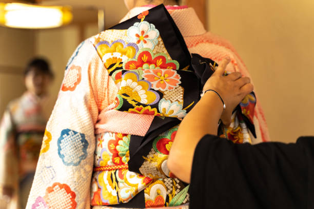 Kimono dressing Kimono dressing furisode stock pictures, royalty-free photos & images