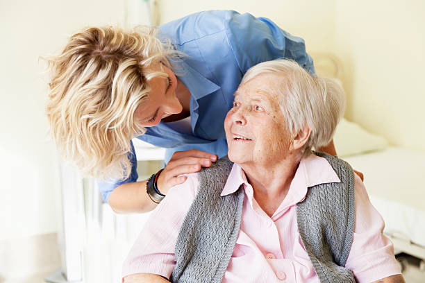 kind care for senior woman stock photo