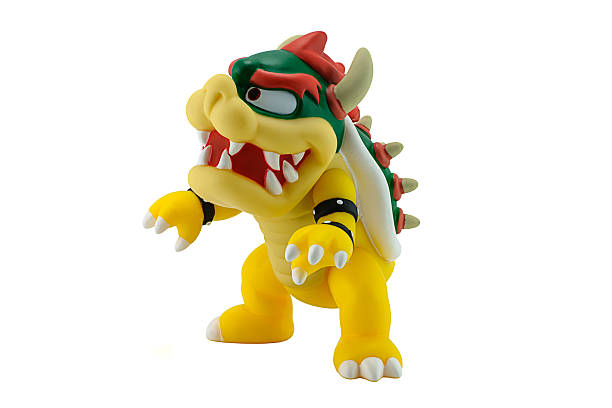 King Bowser Koopa figure Bangkok, Thailand - August 13, 2014 : King Bowser Koopa figure character from Super Mario video game console developed by Nintendo EAD. bowser stock pictures, royalty-free photos & images
