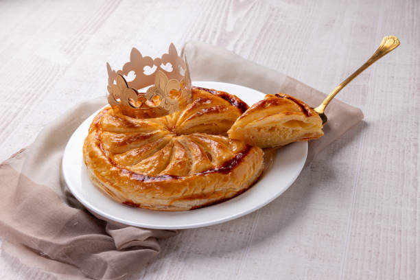King's cake on a plate on a woven surface stock photo