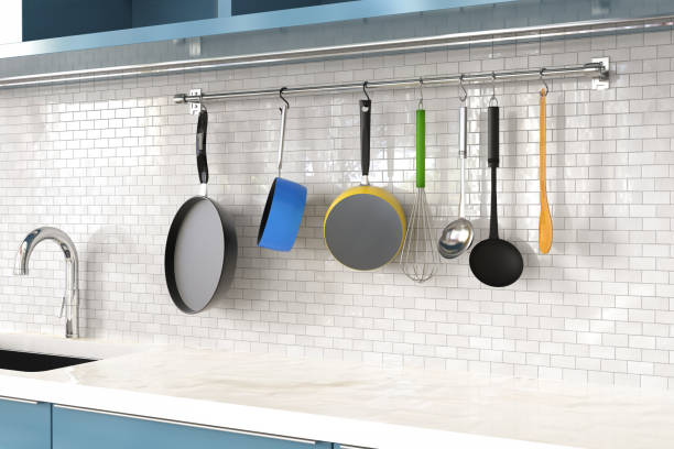 kitchen rack with utensils stock photo