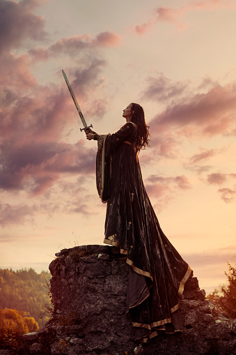 Portrait of woman knight holding big sword