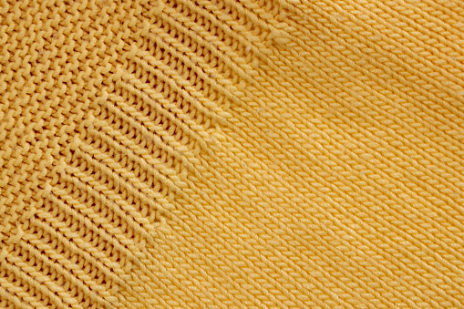 Close up of a woman's hand crocheting
