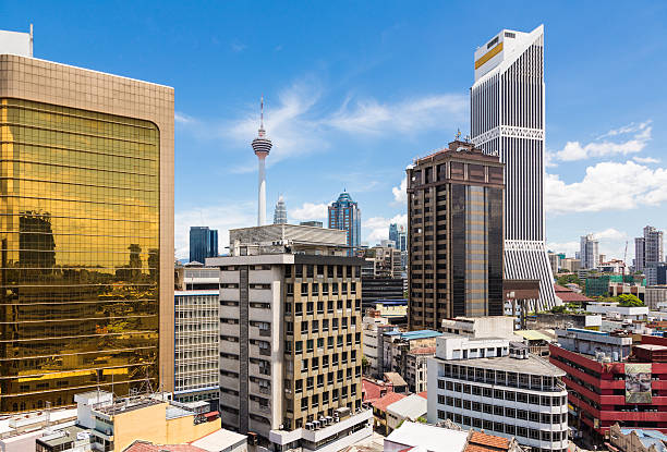 Kuala Lumpur cityscape Kuala Lumpur cityscape around the financial district in Malaysia capital city with the KL tower in the background. The city is an important center for islamic finance in Asia bukit bintang stock pictures, royalty-free photos & images