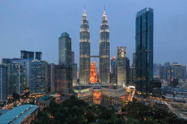 Kuala Lumpur, Malaysia: January 24, 2018: Cityscape of Kuala Lumpur at sunset with Petronas Towers stock photo