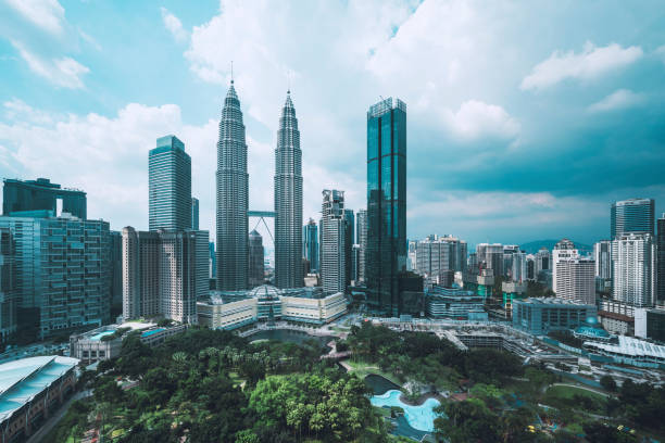 Kuala Lumpur Skyline with Petronas Towers a clody afternoon Kuala Lumpur Skyline at KLCC with Petronas Towers seen a cloudy day. kuala lumpur stock pictures, royalty-free photos & images
