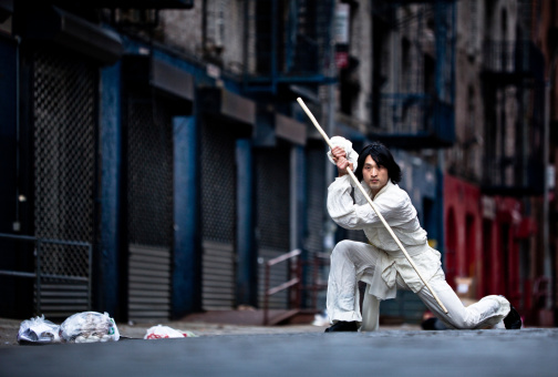 Kung Fu Martial Artist Training In An Alley Stock Photo