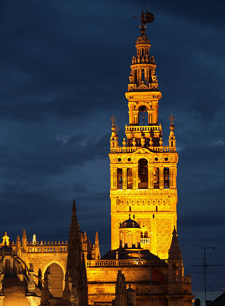 La  Giralda at night, Seville Night view of the Giralda and the Cathedral in Seville, Spain seville cathedral stock pictures, royalty-free photos & images