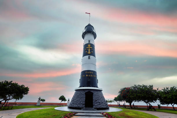 La Marina Lighthouse in Lima Peru with colorful sunset in background stock photo