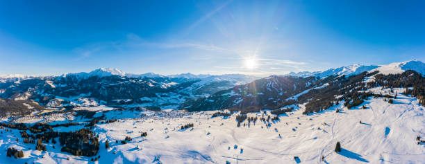 Laax Panorama of the village in the winter mountains covered with snow. Winter landscape. Sun shining. The concept of freedom and solitude. stock photo