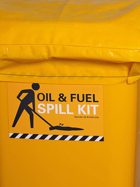 Labeled bright yellow industrial emergency spill kit stock photo