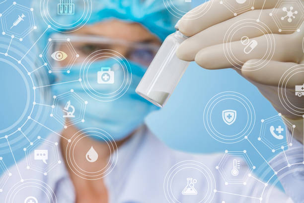 A laboratory assistant holding a bottle with some substance. A closeup of laboratory assistant keeping bottle full of some substance with combs structure with icons and symbols inside at the foreground. The concept of innovative approach in medicine invention. face powder photos stock pictures, royalty-free photos & images